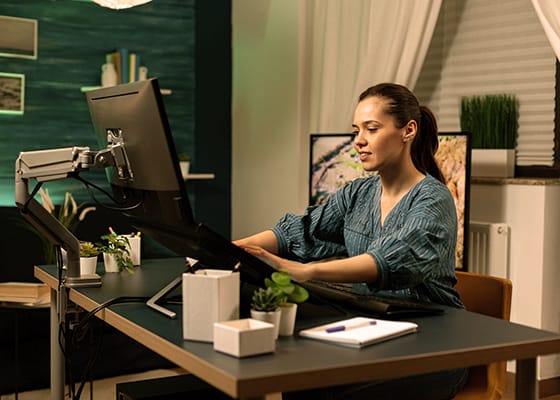 Photo editing specialist working as graphic designer at office - Seahawk