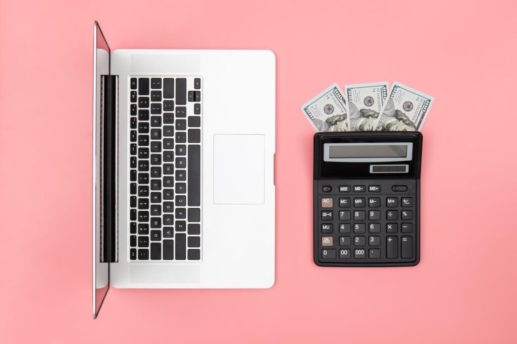calculator-laptop-dollar-bills-colored-background-flat-lay_169016-24509 - Seahawk website-quote