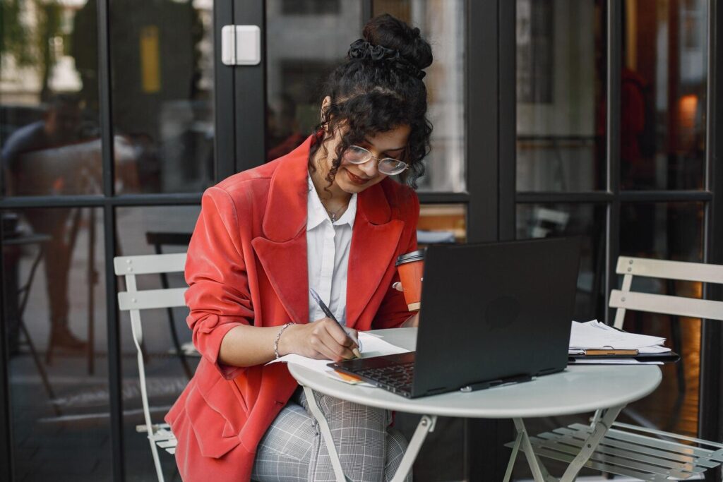 indian-woman-working-laptop-street-cafe-wearing-stylish-smart-clothes-jacket-glasses_1157-50654 - Seahawk Digital Agency Need a Freelancer Alternative