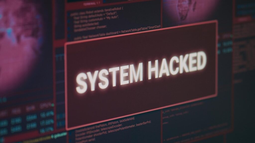 computer-monitor-showing-hacked-system-alert-message-flashing-screen-dealing-with-hacking-cyber-crime-attack-display-with-security-breach-warning-malware-threat-close-up_482257-62207 - Seahawk WordPress-Site-Is-Hacked
