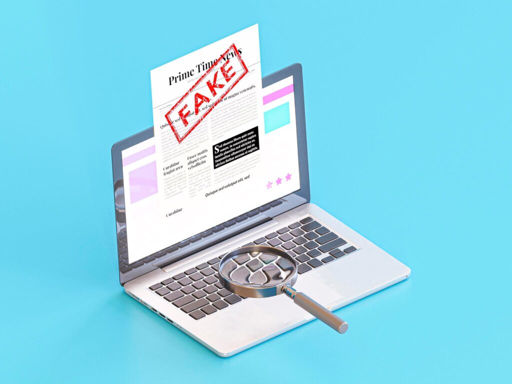 laptop-with-fake-news-magnifying-glass_23-2148824741 - Seahawk changes-on-website-How to check If Your WordPress Site Is Hacked